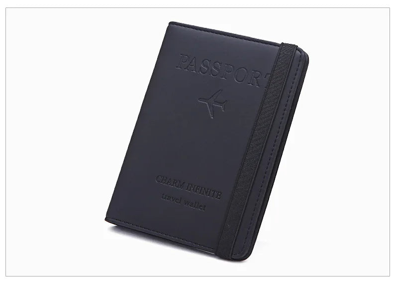 A dark navy passport holder with a leather trim and an airplane emblem.