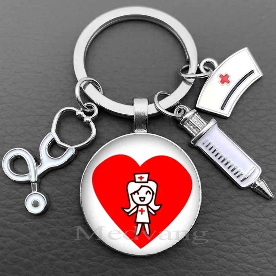 Silver keychain featuring a heart design with a nurse symbol and a stethoscope charm