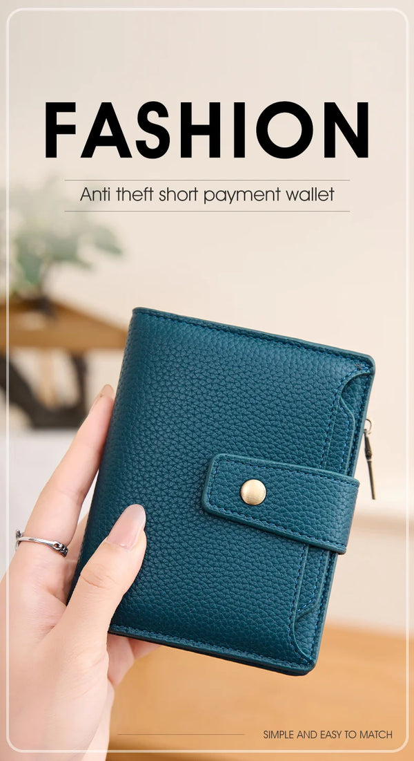 A teal RFID blocking short payment wallet is held in a hand, demonstrating its design.