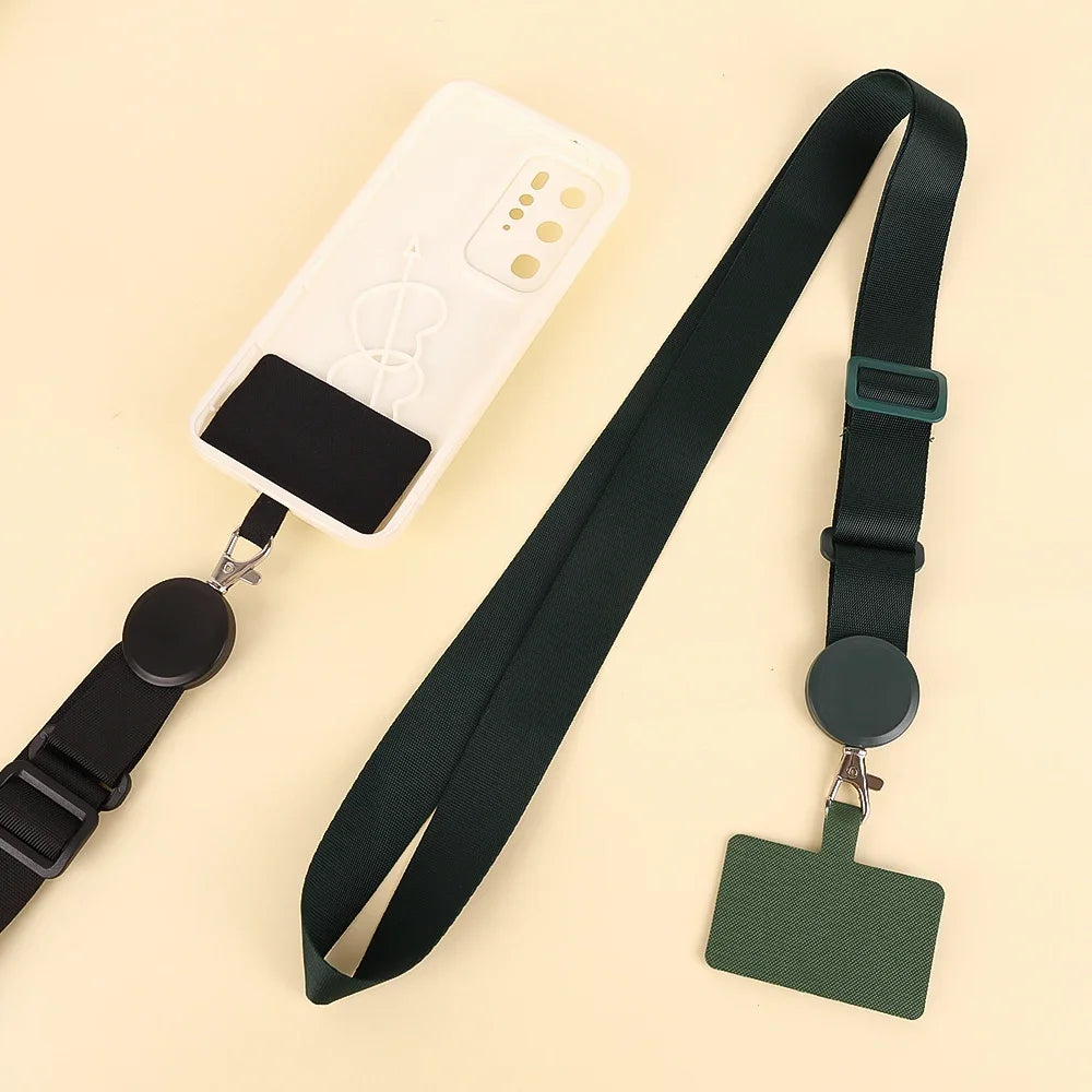 A white phone lanyard with a black clip and a dark green adjustable strap is shown against a light background.
