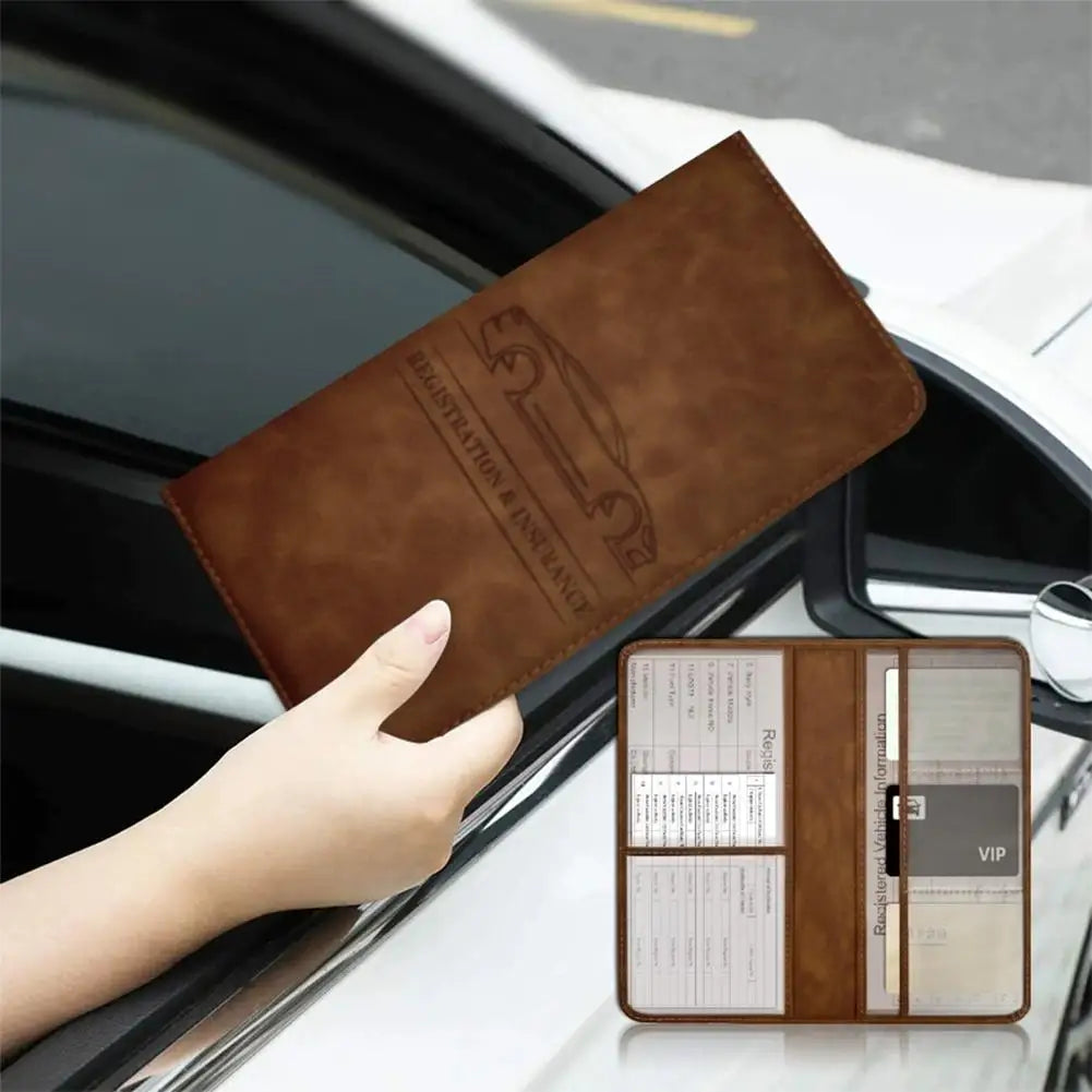 A brown PU leather car document organizer with clear pockets is being held open on a white car interior.