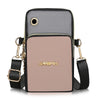 A light pink waterproof nylon crossbody bag with black trim and gold hardware.
