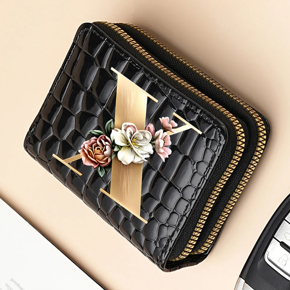 Black PU leather double-zip clutch wallet featuring a gold accent and floral cartoon print
