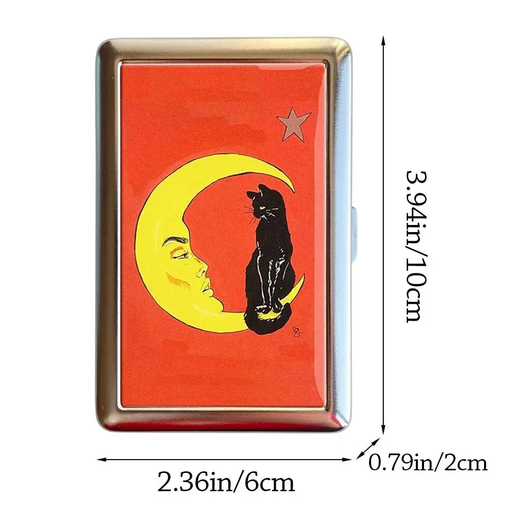A vintage metal card holder featuring a design of a crescent moon and a black cat on an orange background.