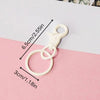 A white hand sewn rhinestone beaded bag charm is shown against a pink background with dimension lines.