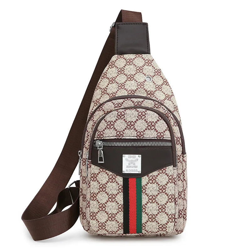 A brown leather crossbody sling bag featuring a beige and brown patterned fabric with green and red stripes.