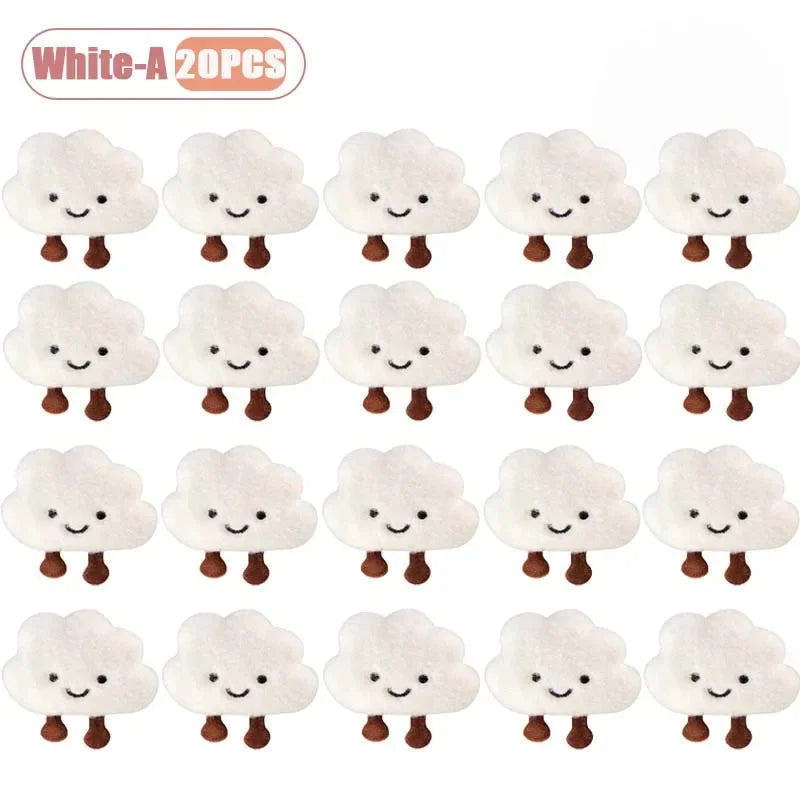 A set of 20 white cloud-shaped plush keychains and brooch pins.