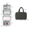 A gray travel toiletry bag with a hanging hook, showing its dimensions and interior compartments.