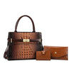 A brown crocodile embossed leather shoulder handbag and matching wallet set.