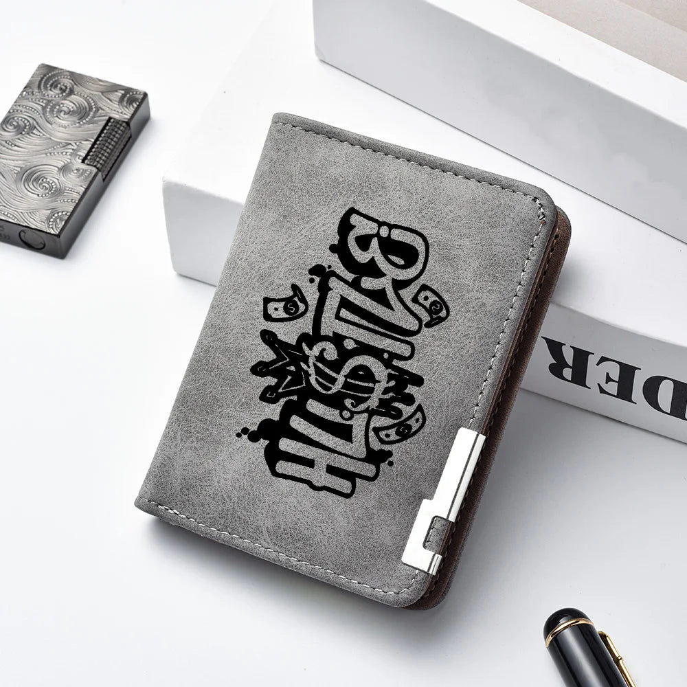 A gray PU leather wallet with a black cartoon print is shown next to a black accessory.