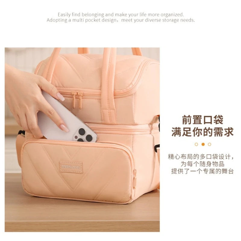 A light peach insulated lunch bag with a multi-pocket design is shown being opened to reveal its interior.