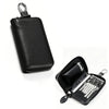 Black compact PU leather key organizer wallet with a zippered closure and a separate compartment for keys.