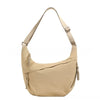 A beige canvas crossbody bag with adjustable straps and drawstring details.