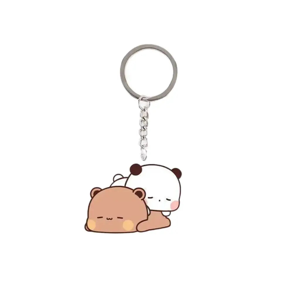A cute cartoon panda keychain charm featuring a black and white bear face.
