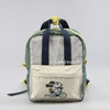 A light gray canvas shoulder bag featuring a Snoopy cartoon design and dark blue straps.