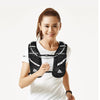 A woman wearing an black hydration vest for trail running and fitness.