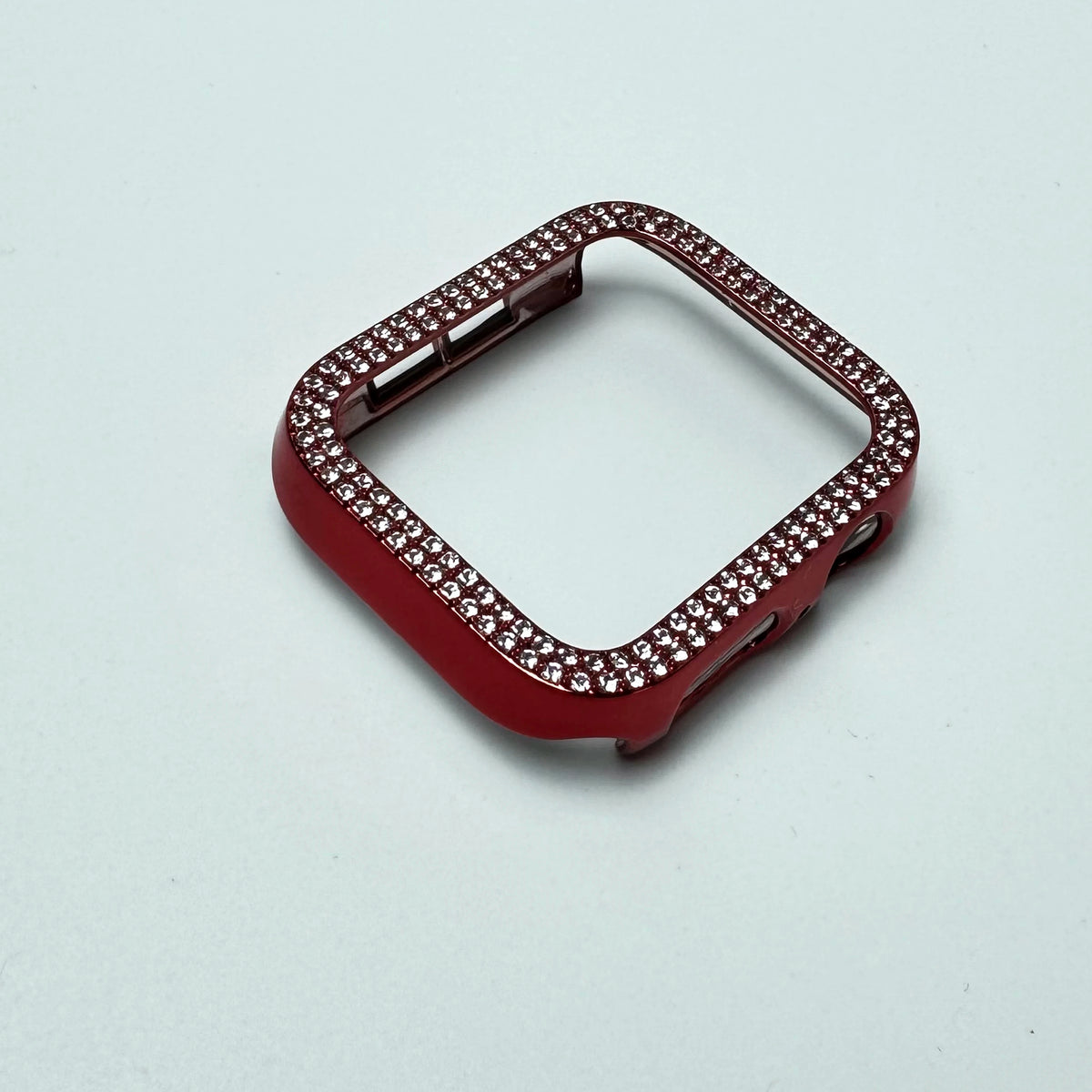A red glitter diamond rhinestone bumper case for an Apple Watch displayed on a light background.