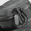 A close-up of a black woven fabric watch organizer travel case with a silver metal clasp.