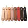 A row of eight leather handbag carry loops in various shades of tan, pink, brown, and black.