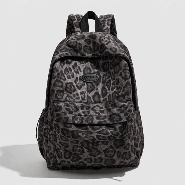 A dark gray leopard print laptop backpack with padded straps.