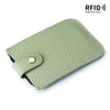 A light green genuine leather slim card holder with a stitched texture and a black lining.