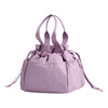A light purple insulated drawstring lunch bag with multiple pockets and fabric handles.