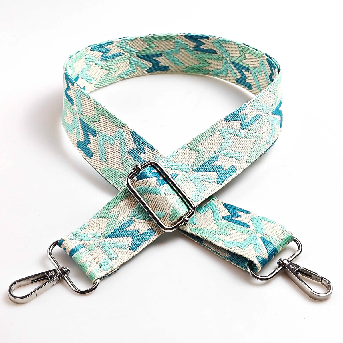 Adjustable wide crossbody bag strap featuring a light blue and white letter M jacquard pattern