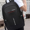 A black Jingpin backpack being held by a person, showing the front view of the bag.
