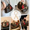 A brown leather shoulder strap is shown attached to a handbag in various contexts.