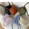 A collection of five pleated PU leather crossbody bags in shades of black, terracotta, olive green, lavender, and blue.