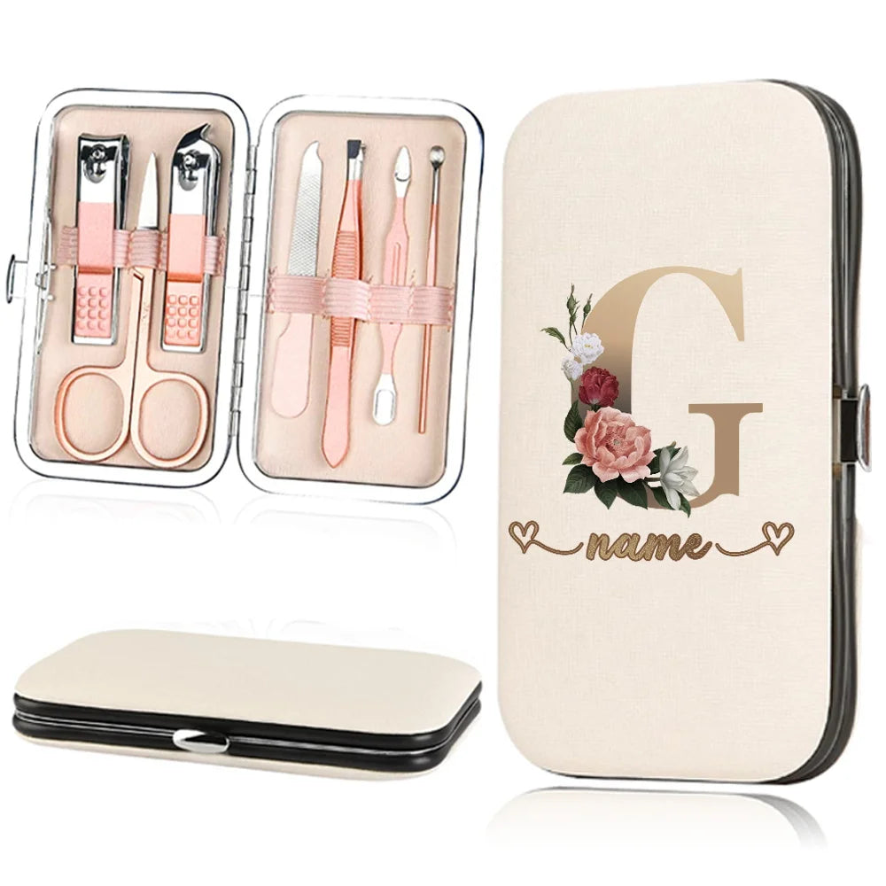 A beige cosmetic kit featuring a stainless steel nail clipper set and a large letter G design.