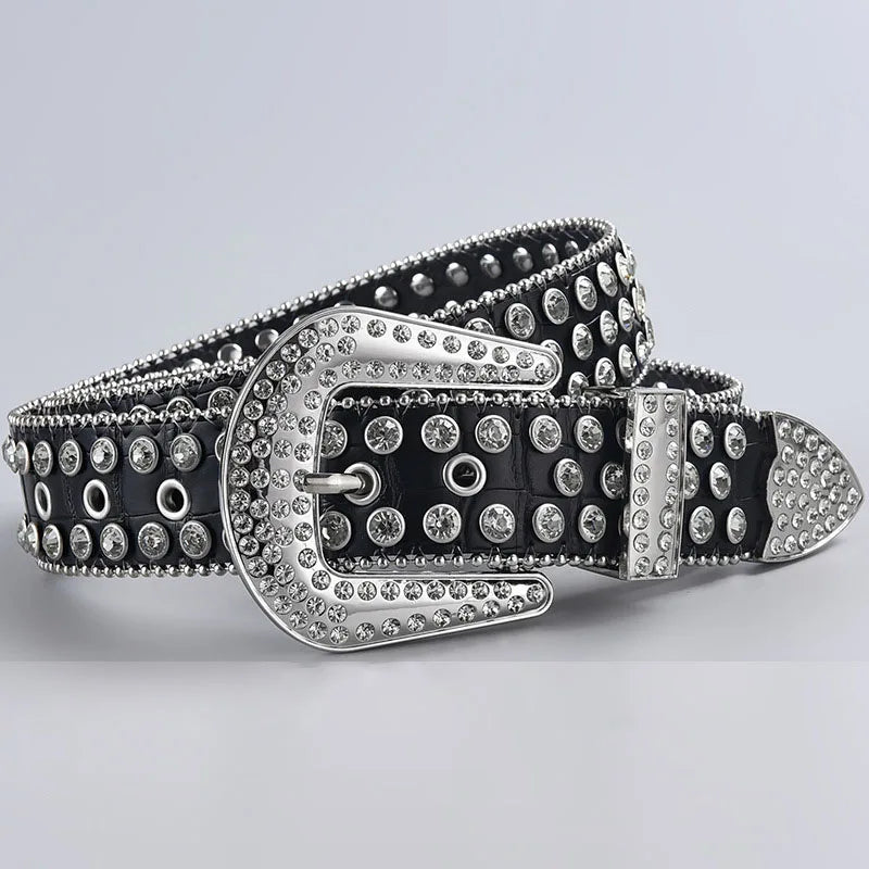 A black leather belt featuring a silver decorative Western buckle adorned with studs and rhinestones.