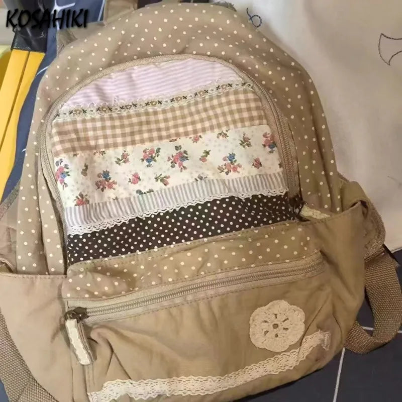 A beige backpack with a layered fabric front featuring floral prints and checkered patterns.