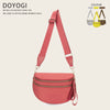 A pink nylon crossbody bag with a strap is displayed against a light background.