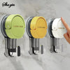 Three suction hook devices in green, yellow, and white are shown mounted on a clear surface.