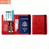 A red leather passport holder with RFID blocking features, containing a passport and boarding pass.