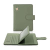 A green PU leather passport holder with credit card slots shown open and closed.