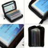 A black zippered pouch containing a stack of credit cards and a blue card inside.