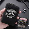 A black leather card wallet with a zipper closure is shown being held, featuring embroidered text and multiple card slots.