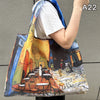 A canvas print depicting a vibrant street scene with people and architecture on a foldable nylon shopping tote.