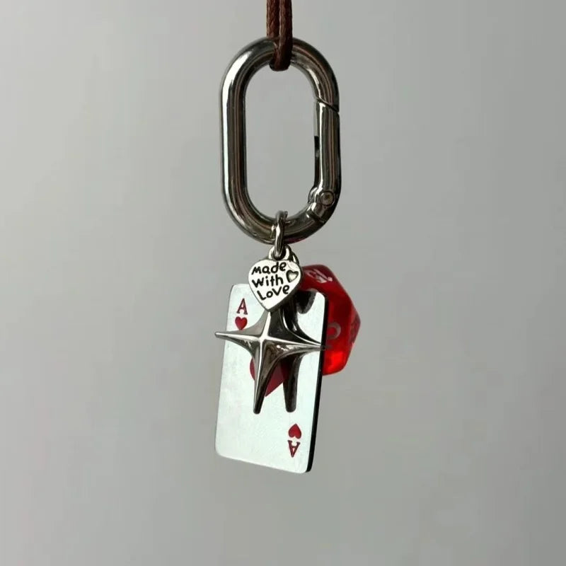 Silver keychain featuring a playing card design with a star and the text Made with Love