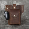 A brown genuine leather men's waist bag with a flap and a loop for keys is shown against a gray background.