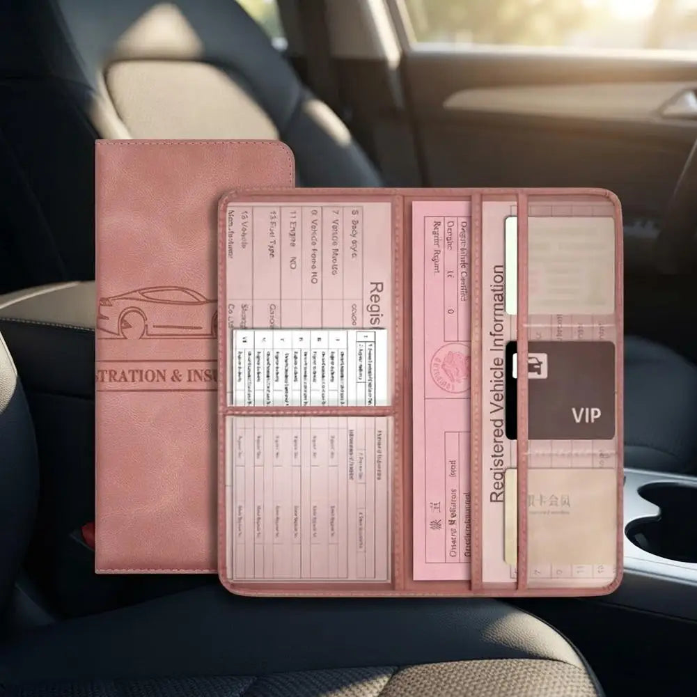 A pink PU leather car document organizer with clear pockets resting on a dark car seat.