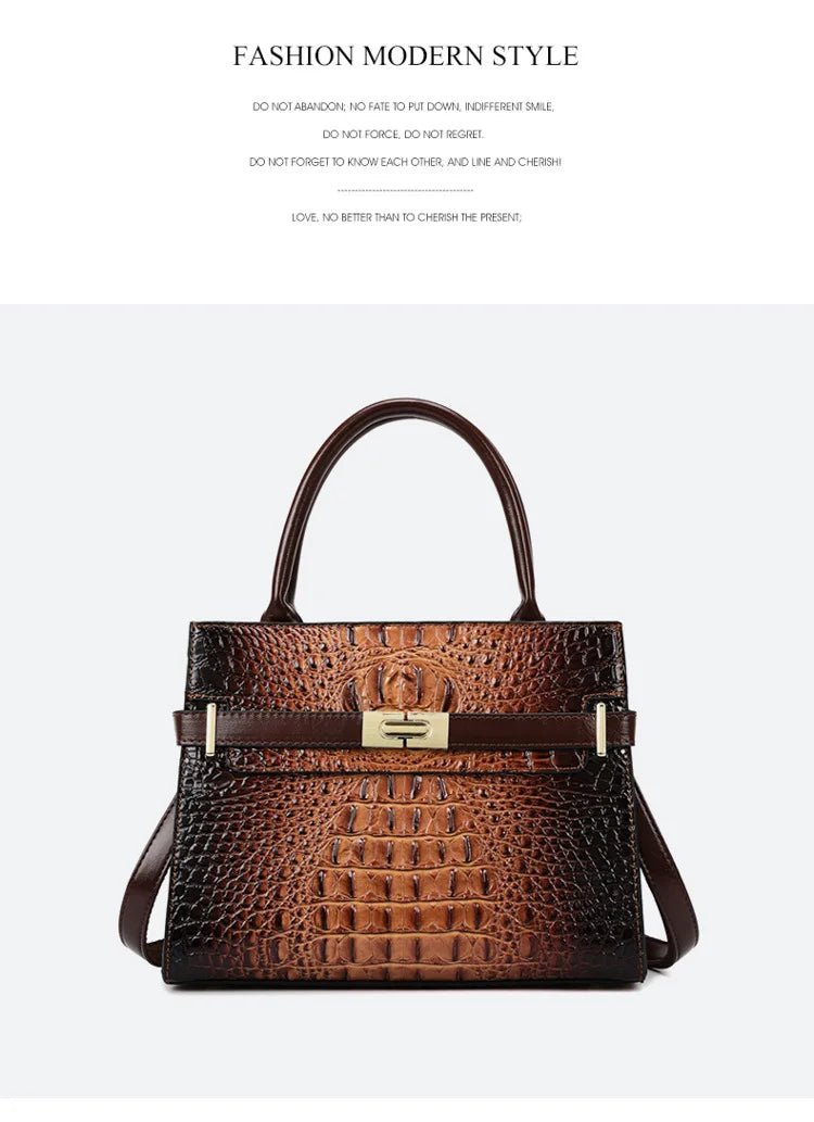 A brown crocodile embossed leather shoulder handbag with a gold buckle and matching strap.