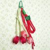 A set of red and green aesthetic tulip flower bag charm keychains on a white background.