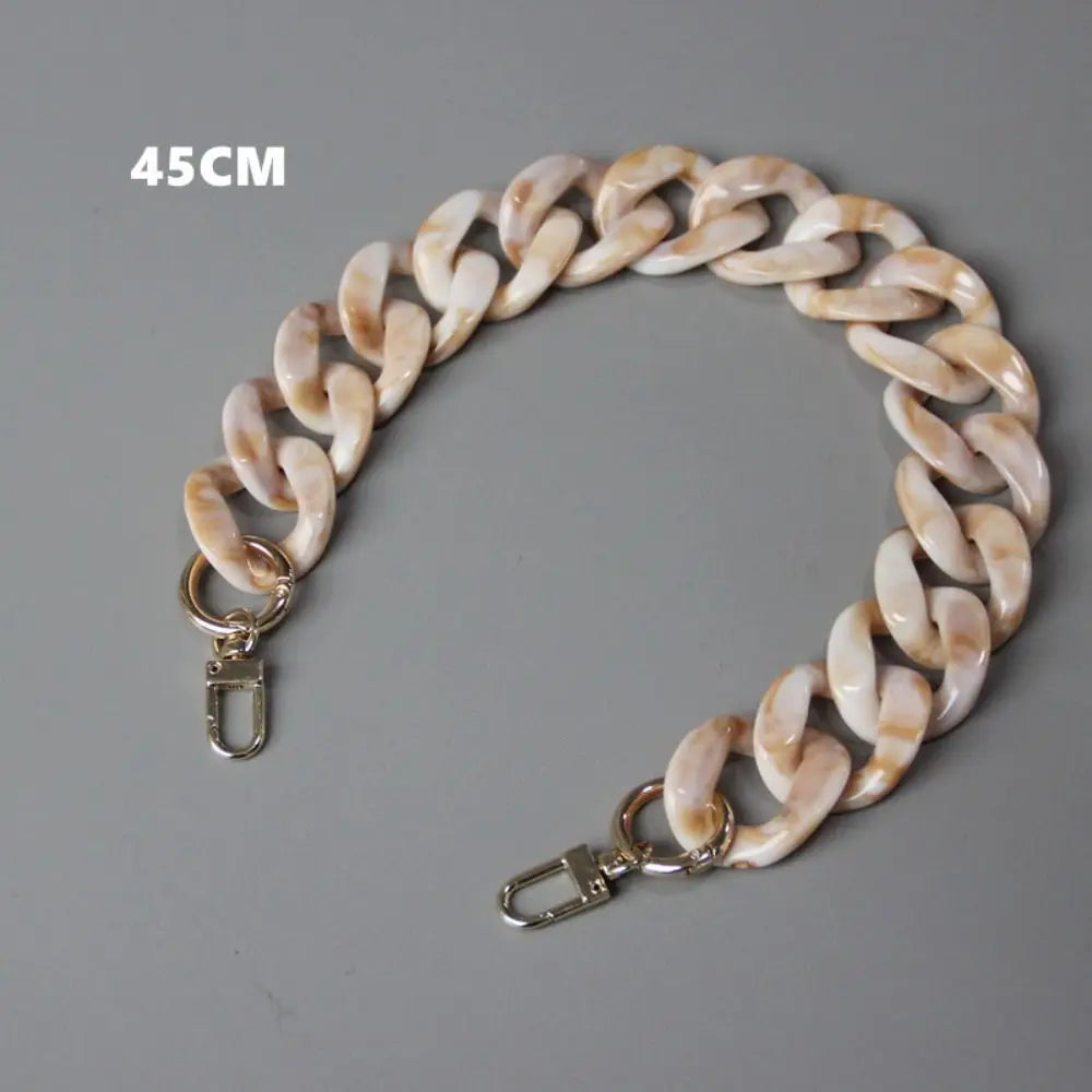 A 45cm light beige acrylic resin detachable bag chain strap with a silver clasp.