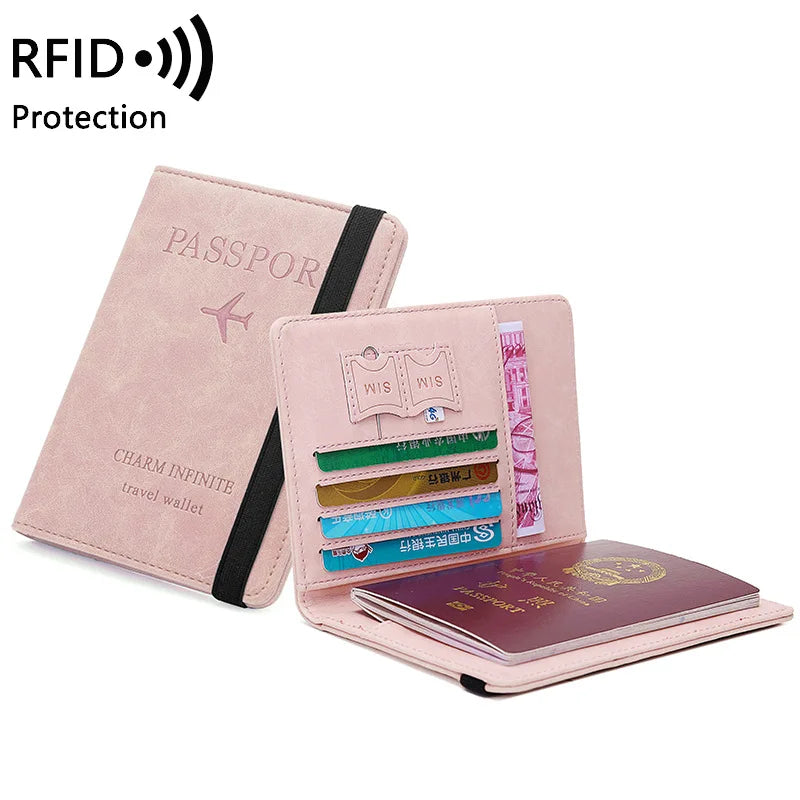 A pink premium PU leather travel passport holder with slots for documents and a charm design.