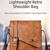 A brown leather shoulder bag featuring a flap closure and stitching, shown on a wooden surface.