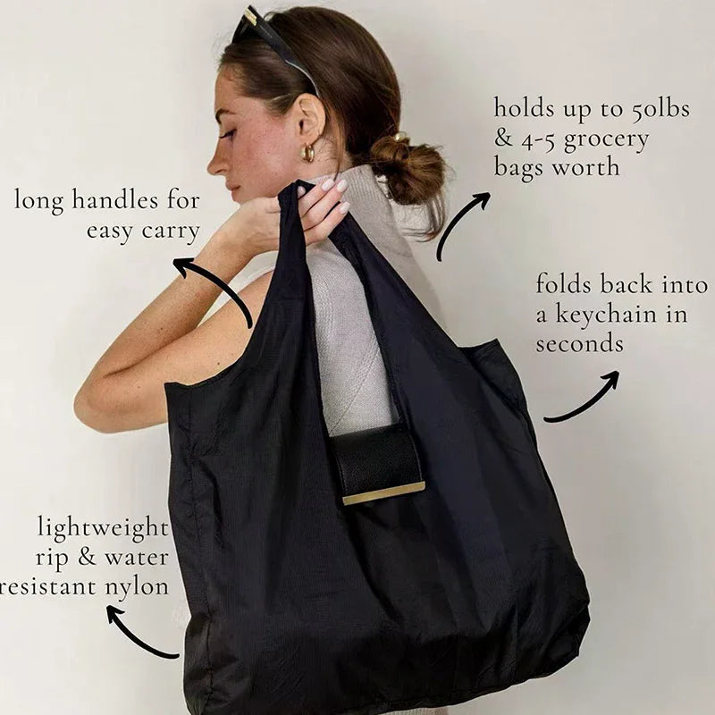 A woman holds a black cloth storage pouch bag, demonstrating its features like long handles and durability.