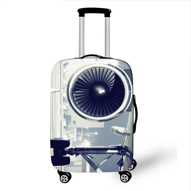 A silver suitcase with a large, circular, fan-like design on the front, being pulled by wheels.